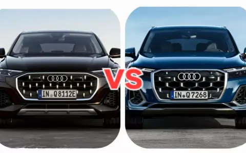 Dwa Audi Q7, czarne i niebieskie, z napisem VS pośrodku.